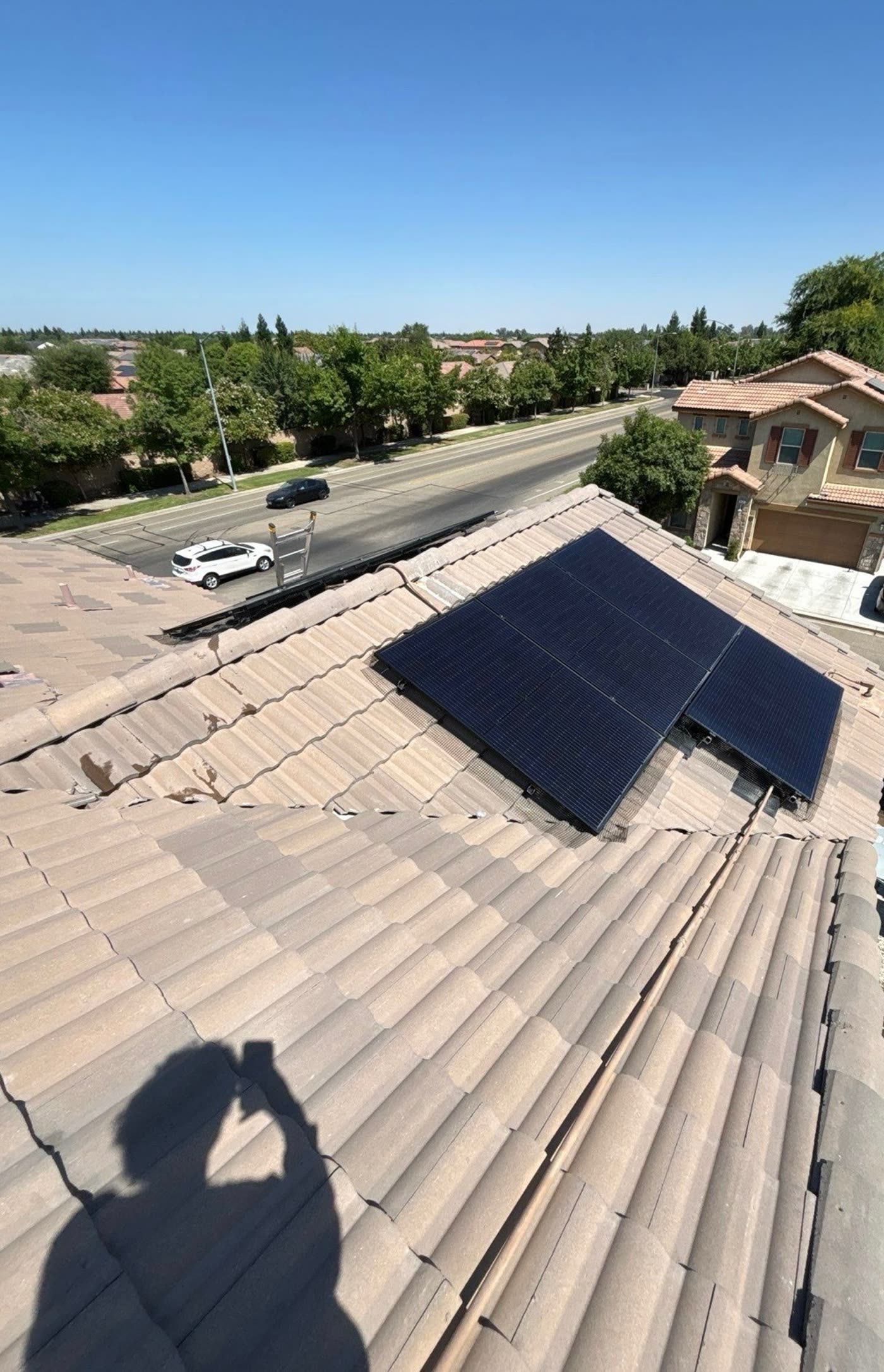 The same solar panel after cleaning, with clean glass and clear tile around it